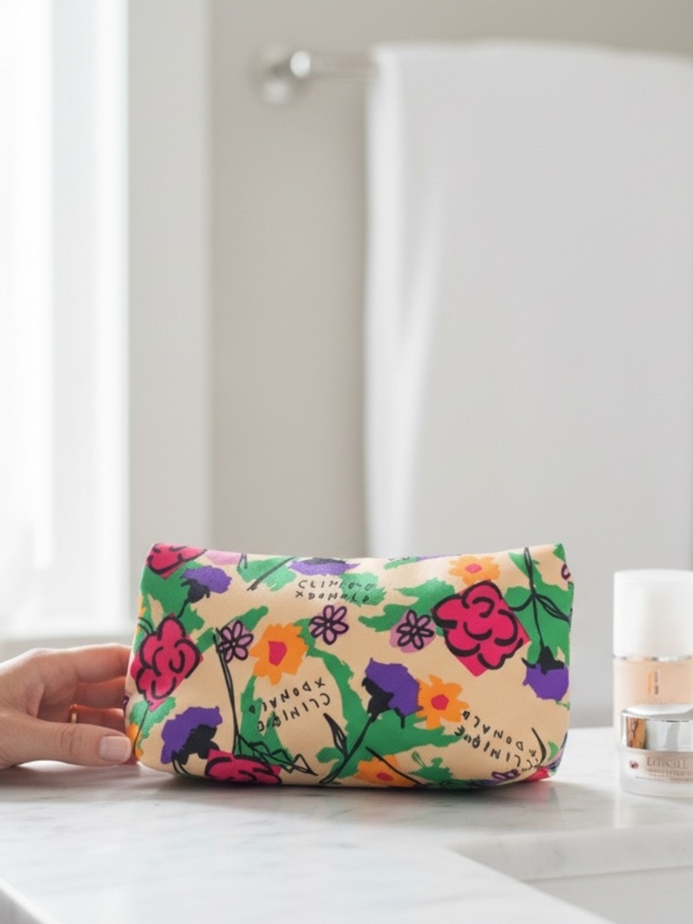 Clinique x Donald Robertson floral cosmetics  bags a large and a small floral